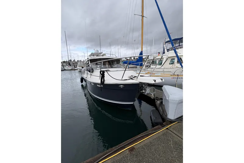 Andiamo Yacht Photos Pics 2020 Cutwater C-28 boat docked at marina under cloudy skies.