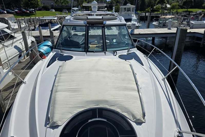  Yacht Photos Pics 2009 Four Winns V435 yacht docked at marina, showcasing sleek design and spacious deck.