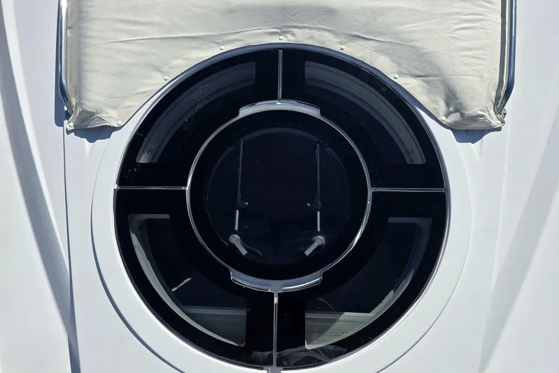  Yacht Photos Pics Circular window on 2009 Four Winns V435 boat, partially covered with fabric.