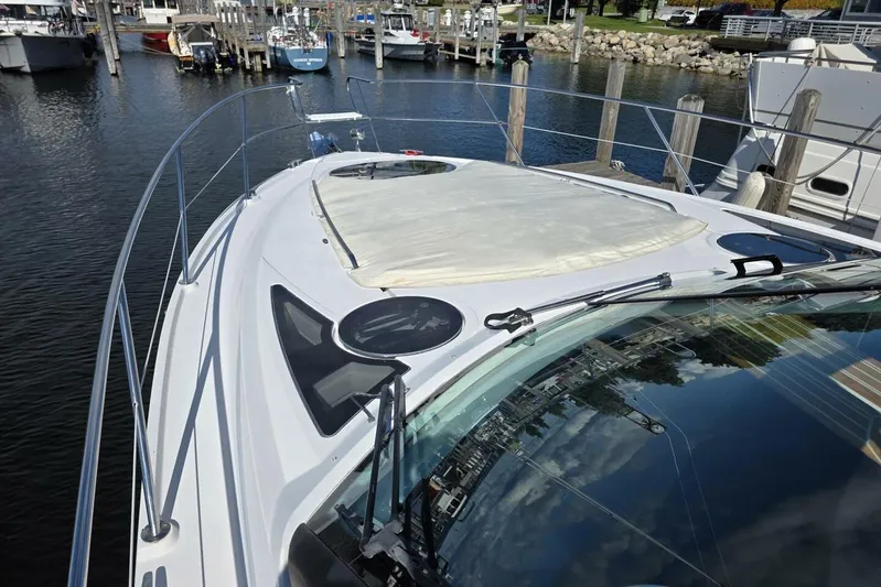  Yacht Photos Pics 2009 Four Winns V435 yacht docked at marina, showcasing sleek deck design.