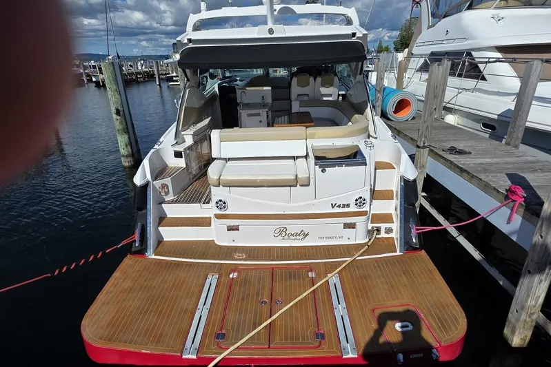  Yacht Photos Pics 2009 Four Winns V435 yacht docked, featuring spacious deck and seating area.