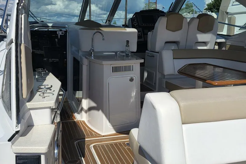  Yacht Photos Pics Luxurious interior of 2009 Four Winns V435 yacht with seating and kitchenette.