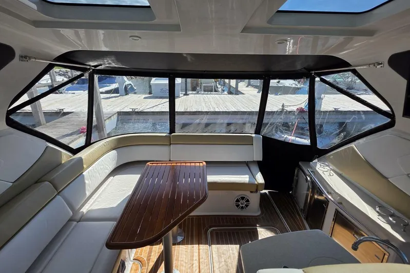  Yacht Photos Pics Luxurious interior of 2009 Four Winns V435 yacht with seating and wooden table.