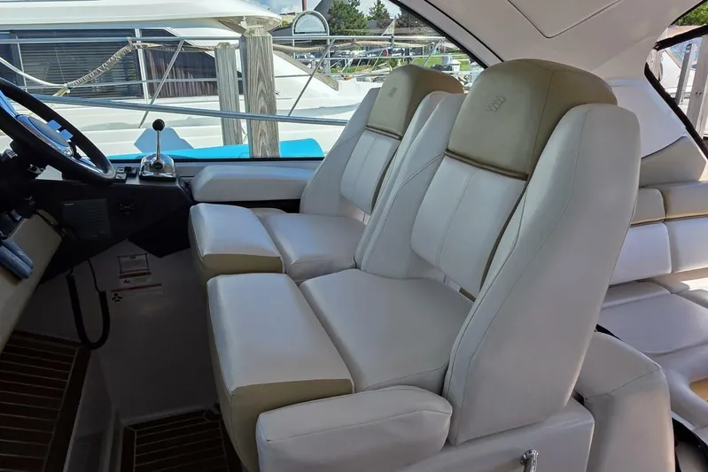  Yacht Photos Pics 2009 Four Winns V435 yacht interior with plush white seating and modern controls.