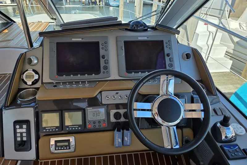  Yacht Photos Pics 2009 Four Winns V435 helm with dual displays, steering wheel, and navigation controls.