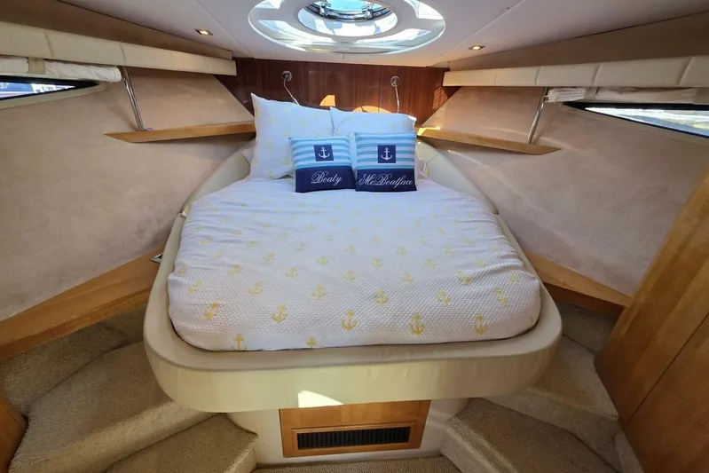  Yacht Photos Pics Luxurious 2009 Four Winns V435 yacht cabin with cozy bed and nautical decor.