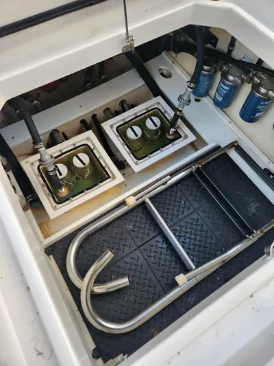  Yacht Photos Pics Engine compartment of a 2019 HCB 39 Speciale boat, showing fuel filters and metal ladder.