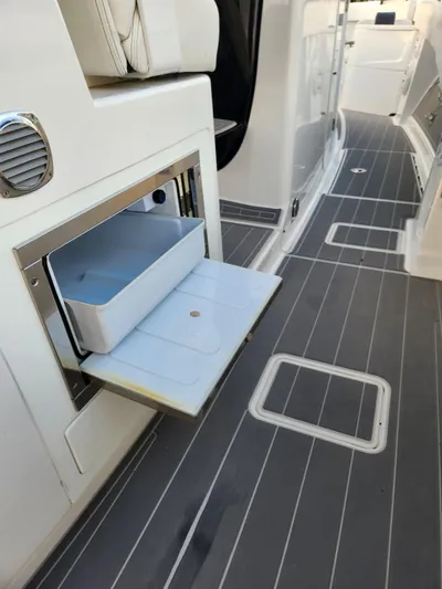  Yacht Photos Pics 2019 HCB 39 Speciale boat interior with open storage compartment and sleek flooring.