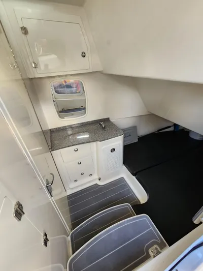  Yacht Photos Pics 2019 HCB 39 Speciale cabin interior with sink, storage, and seating area.