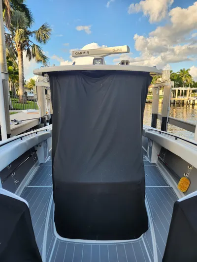  Yacht Photos Pics 2019 HCB 39 Speciale boat interior with Garmin equipment, docked by palm trees.