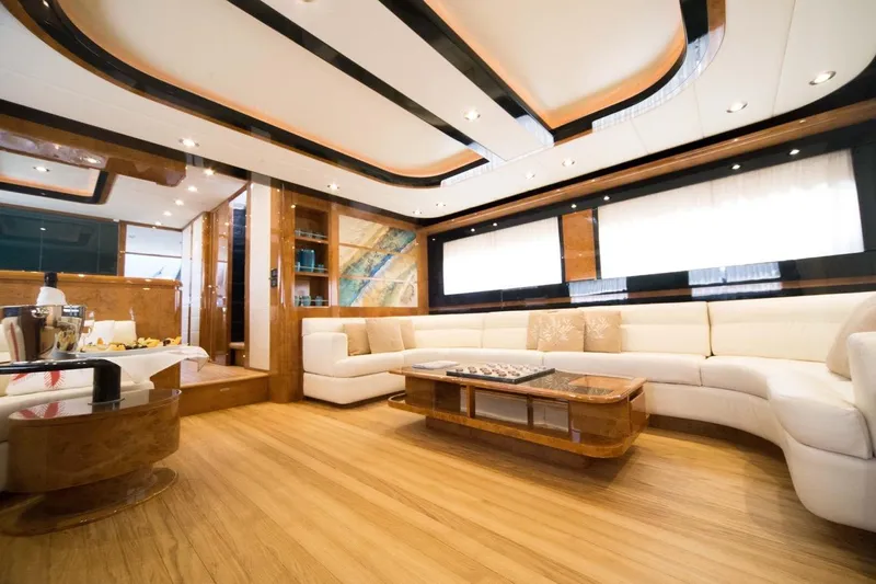 Zia Canaia Yacht Photos Pics Luxurious interior of 2001 Riva Opera 80 yacht with elegant wood and white furnishings.