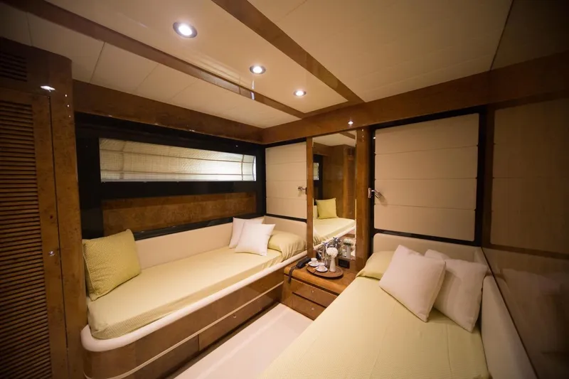 Zia Canaia Yacht Photos Pics Luxurious cabin interior of 2001 Riva Opera 80 yacht with twin beds and elegant decor.