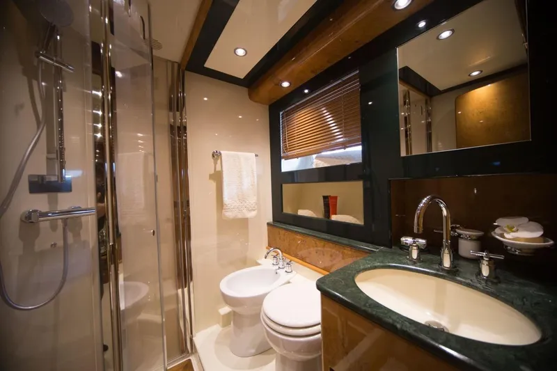 Zia Canaia Yacht Photos Pics Luxurious bathroom in 2001 Riva Opera 80 yacht with modern fixtures and elegant design.