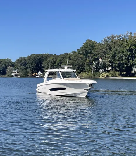 Sea Lion Yacht Photos Pics 2019 Boston Whaler 420 Outrage cruising on a serene lake.