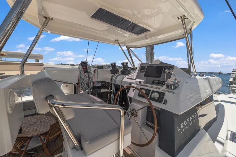 One Love Yacht Photos Pics 2019 Leopard 50 yacht helm station with modern navigation equipment and comfortable seating.