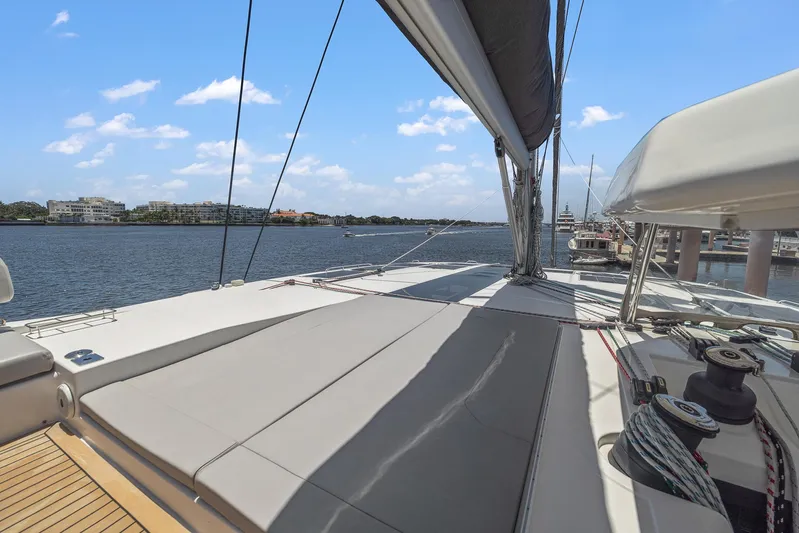 One Love Yacht Photos Pics 2019 Leopard 50 yacht deck with scenic waterfront view.