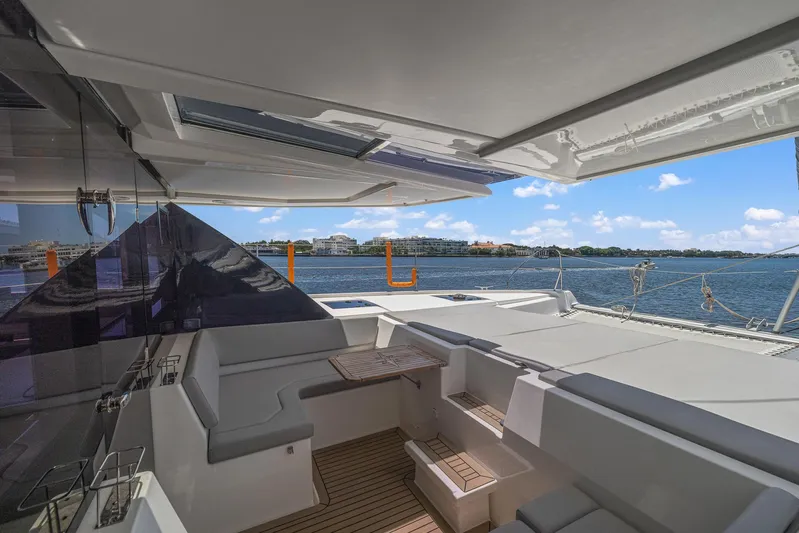 One Love Yacht Photos Pics 2019 Leopard 50 yacht interior with ocean view and seating area.