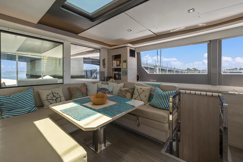One Love Yacht Photos Pics Luxurious interior of 2019 Leopard 50 yacht with spacious seating and panoramic windows.