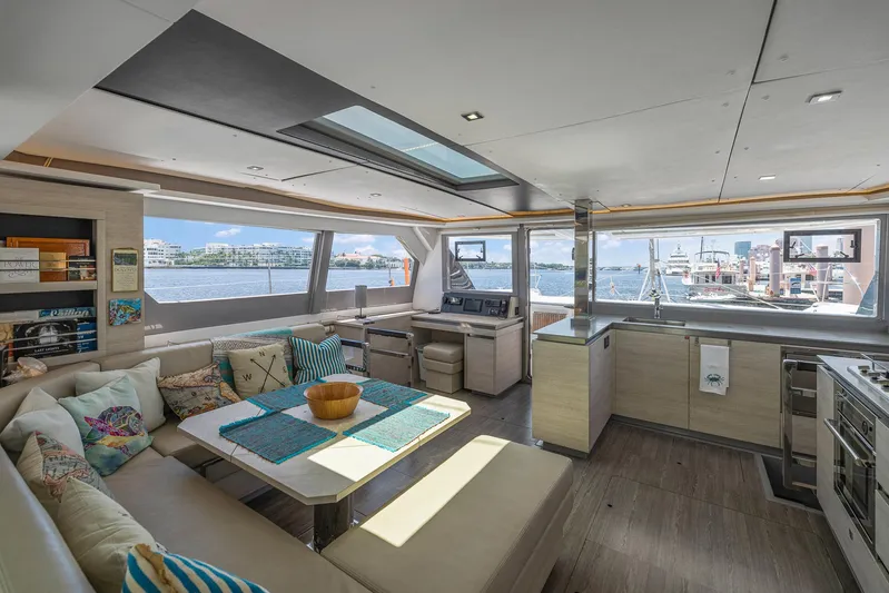 One Love Yacht Photos Pics Luxurious interior of 2019 Leopard 50 yacht with panoramic windows and modern furnishings.