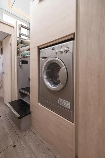 One Love Yacht Photos Pics Built-in washing machine in a 2019 Leopard 50 yacht interior.