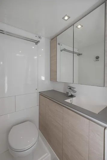 One Love Yacht Photos Pics Modern bathroom in a 2019 Leopard 50 yacht with sleek fixtures and ample storage.