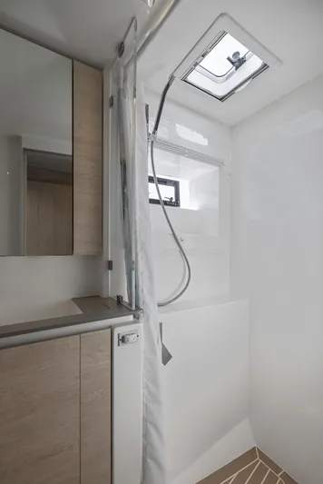 One Love Yacht Photos Pics Modern bathroom in 2019 Leopard 50 yacht with shower and wooden cabinetry.