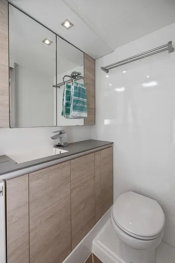 One Love Yacht Photos Pics Modern bathroom in a 2019 Leopard 50 yacht with sleek fixtures and ample storage.