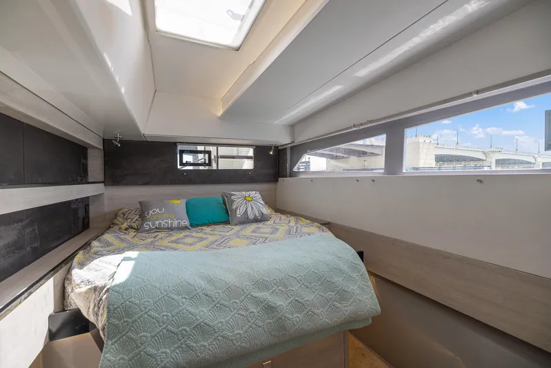 One Love Yacht Photos Pics Cozy bedroom in 2019 Leopard 50 yacht with skylight and large windows.