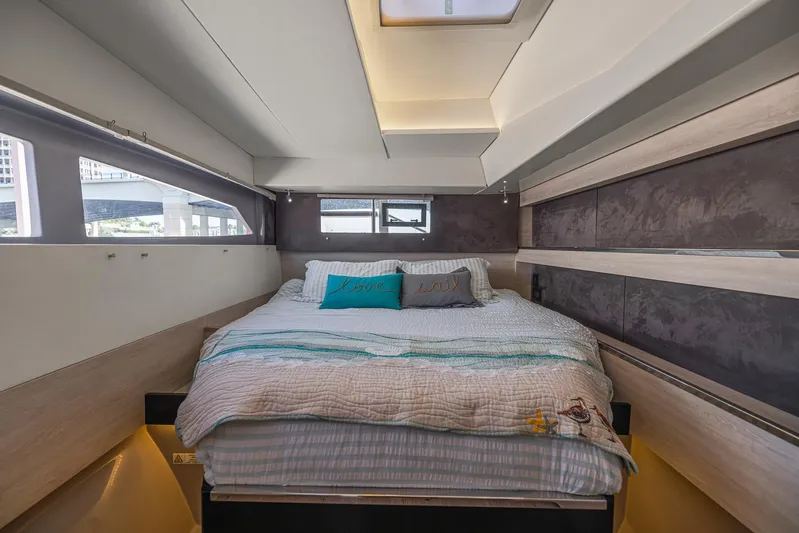 One Love Yacht Photos Pics Luxurious bedroom interior of 2019 Leopard 50 yacht with cozy bedding and modern design.