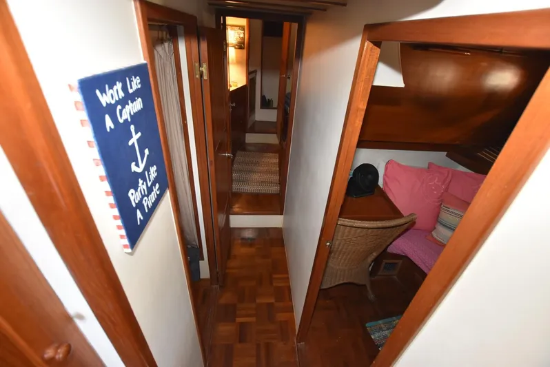 In Do Time Yacht Photos Pics 1983 Kadey-Krogen Trawler interior with wood paneling, cozy seating, and nautical decor.