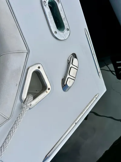 Farbrengen Yacht Photos Pics 1982 Bertram 54 Convertible boat deck with cleat and rope detail.