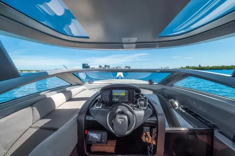  Yacht Photos Pics Interior view of 2017 Tecnomar Evo 55 yacht cockpit with modern navigation system.
