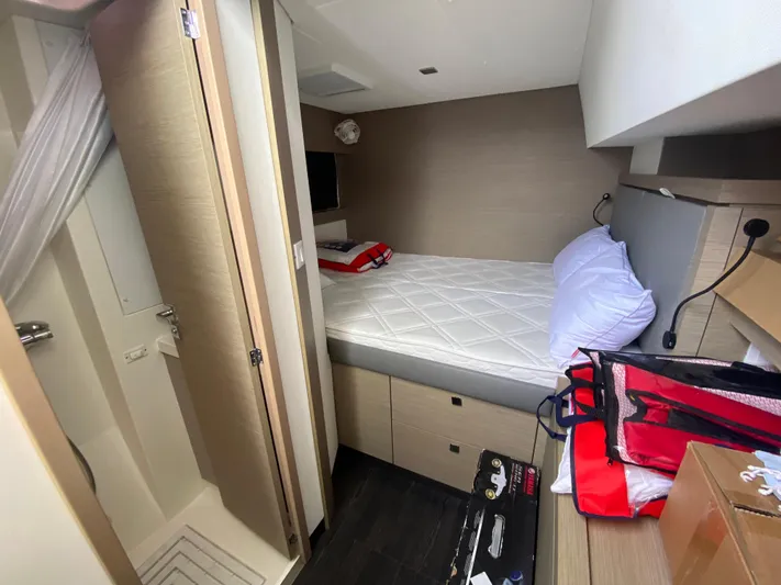 Enotan Yacht Photos Pics Cabin interior of 2020 Fountaine Pajot Saona 47 catamaran with bed and storage.