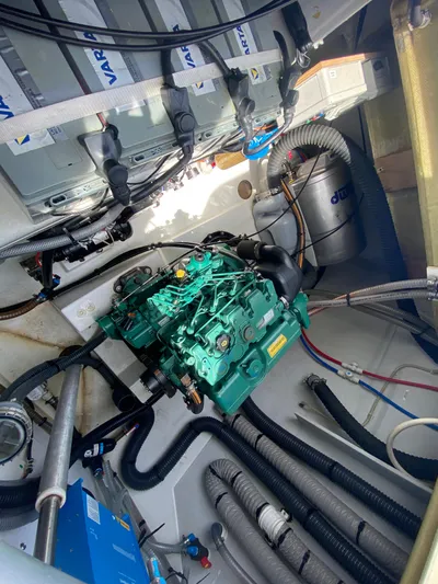 Enotan Yacht Photos Pics Engine room of 2020 Fountaine Pajot Saona 47 catamaran with visible machinery and wiring.