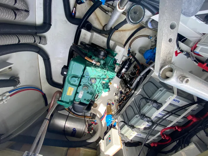 Enotan Yacht Photos Pics Engine room of a 2020 Fountaine Pajot Saona 47 catamaran, showcasing mechanical components and wiring.