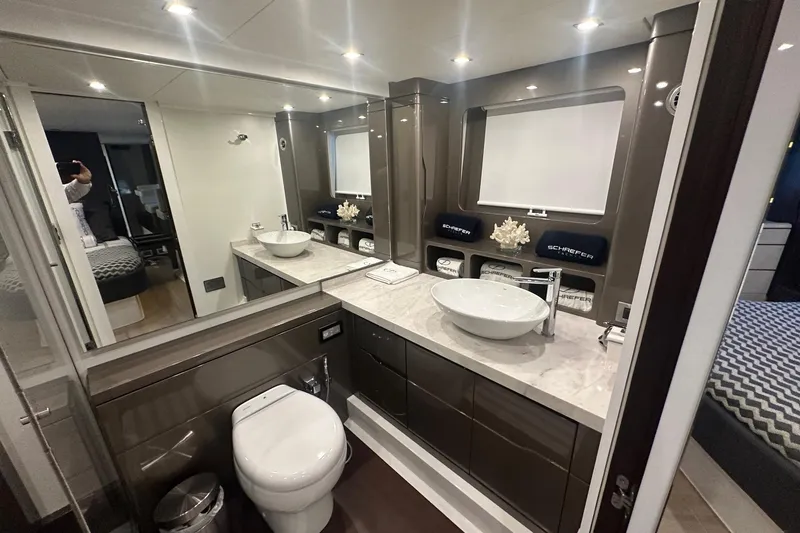 American Dream Yacht Photos Pics Luxurious bathroom in 2023 Schaefer 660 yacht with modern fixtures and elegant design.