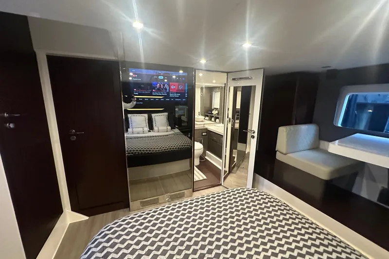 American Dream Yacht Photos Pics Luxurious interior of 2023 Schaefer 660 yacht with modern bedroom and bathroom.