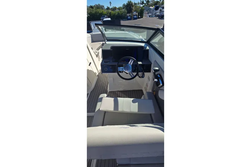  Yacht Photos Pics 2023 Sea Ray SDX 270 Outboard boat interior with steering wheel and seating.