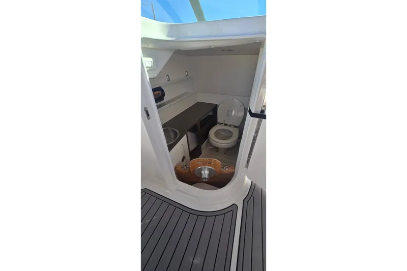  Yacht Photos Pics 2023 Sea Ray SDX 270 Outboard boat interior with toilet and sink.