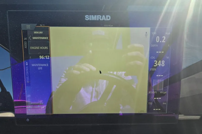  Yacht Photos Pics Simrad display on 2023 Sea Ray SDX 270 Outboard showing engine hours and navigation data.