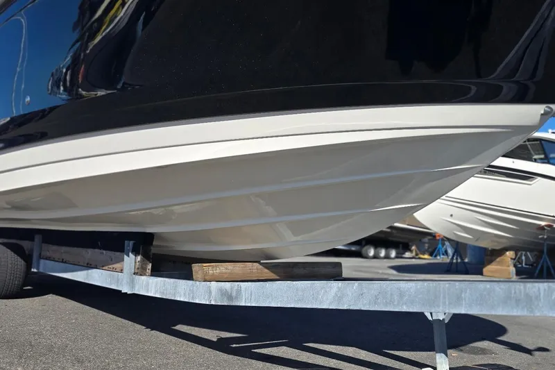  Yacht Photos Pics 2023 Sea Ray SDX 270 Outboard boat hull on trailer, close-up view.