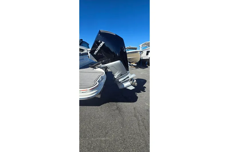  Yacht Photos Pics 2023 Sea Ray SDX 270 Outboard with Mercury engine, docked under clear blue sky.