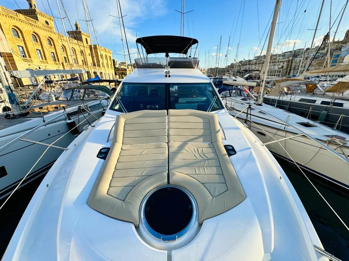 The Office Yacht Photos Pics Sunseeker Manhattan 55 yacht, 2015 model, docked in a marina with clear skies.