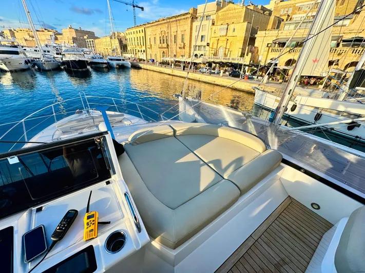 The Office Yacht Photos Pics Luxurious 2015 Sunseeker Manhattan 55 yacht docked in a scenic marina.