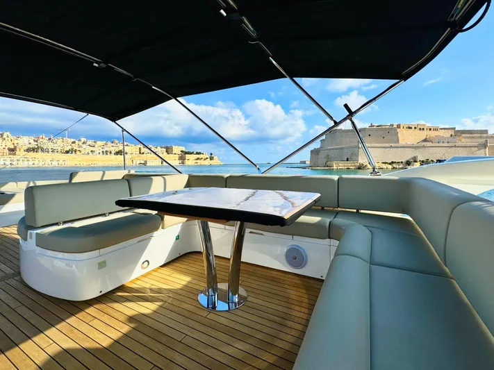 The Office Yacht Photos Pics Luxurious Sunseeker Manhattan 55 yacht interior with elegant seating and scenic ocean view.