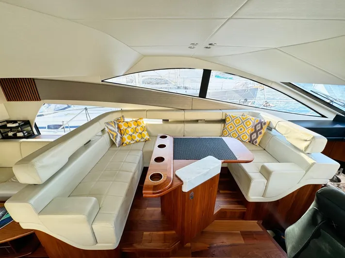 The Office Yacht Photos Pics Luxurious interior of 2015 Sunseeker Manhattan 55 yacht with elegant seating and stylish decor.