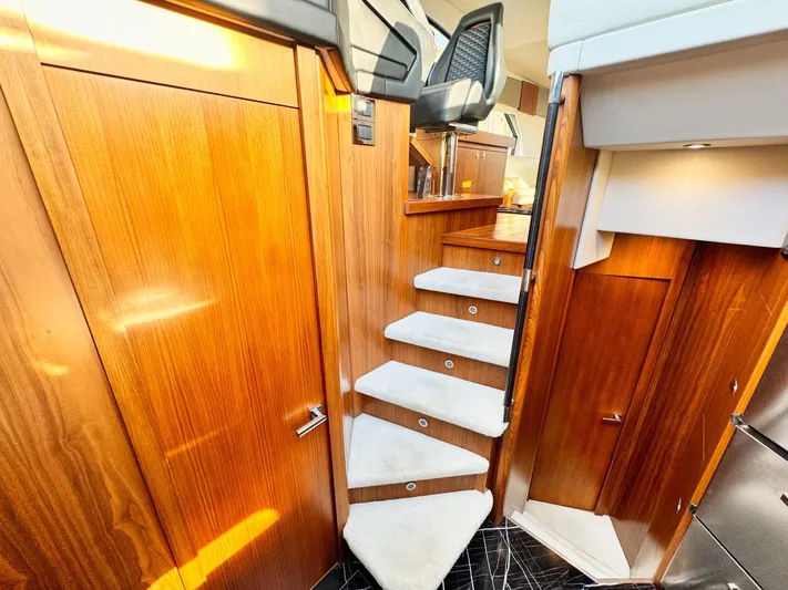 The Office Yacht Photos Pics Interior of 2015 Sunseeker Manhattan 55 yacht with wooden stairs and modern design.