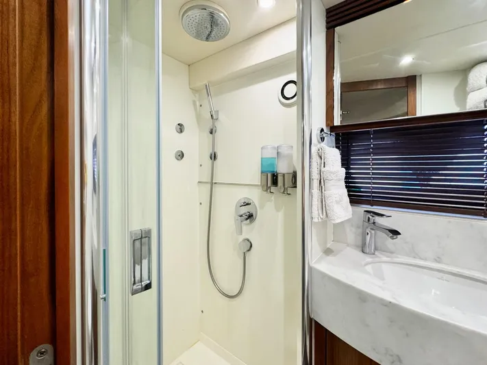 The Office Yacht Photos Pics Luxurious bathroom in 2015 Sunseeker Manhattan 55 yacht with modern shower and sleek sink.