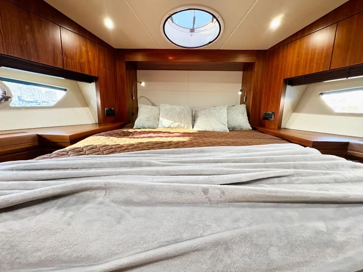 The Office Yacht Photos Pics Luxurious cabin interior of 2015 Sunseeker Manhattan 55 yacht with cozy bedding.