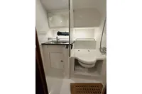 Modern bathroom in 2023 Nimbus 305 Coupe yacht, featuring sleek design and compact amenities.